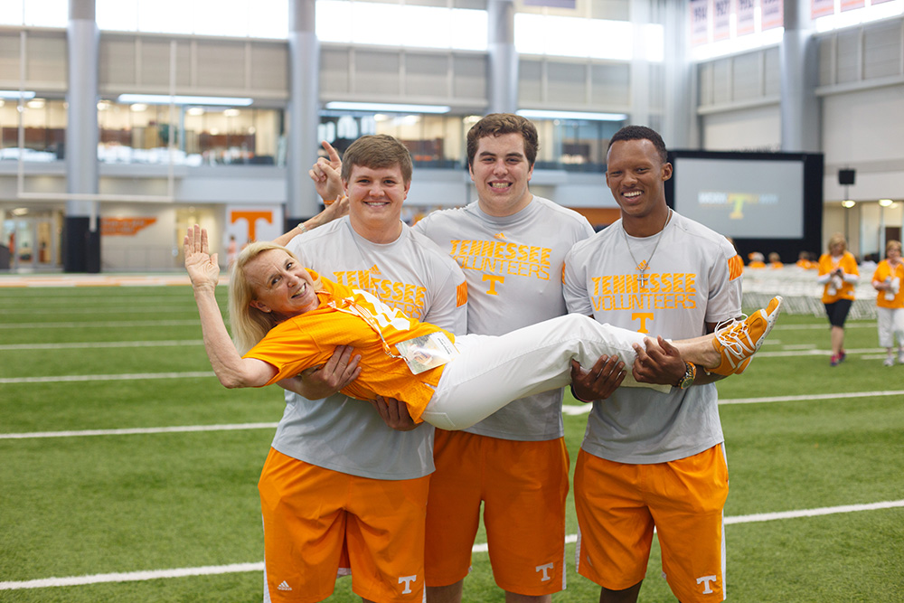 Marilyn Elrod (pictured with Tennessee football players Mack Crowder, Thomas Edwards and Josh Dobbs) 