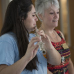 Professor Shelley Binder listens to student Jacqueline Messinetti play the flute. 