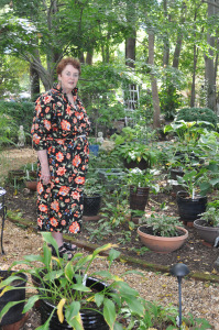 Cornelia Holland in garden of hostas