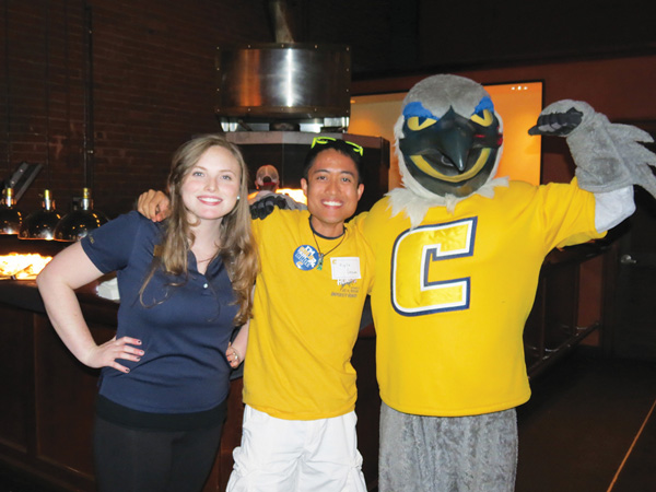 UTC Young Alumni and Scrappy at the annual Homecoming Tap Party.