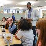 Fisher, who is SGA president, talks with students