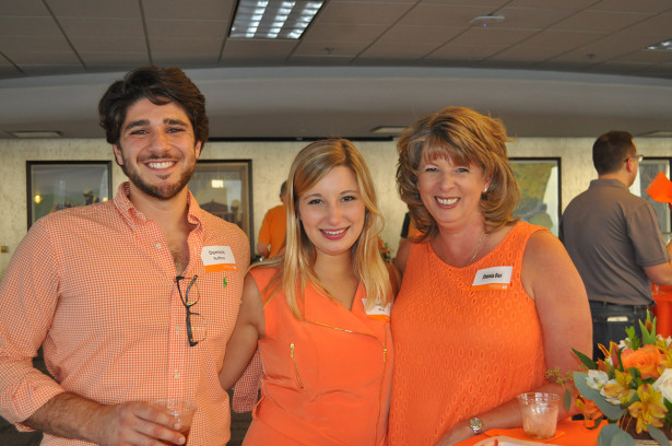 Dominic Ruffno, Shelbi Bias and Rhonda Bias enjoy the Orange and White Networking Night at the AT&T Building in Nashville before the football season opener.
