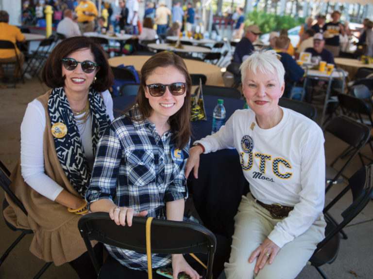 Becky Farmer Browder (Chattanooga ’81, ’87), Betsy Browder and Susan Frady Robinson (Chattanooga ’90) visit in the UTC alumni tent during a Mocs game.