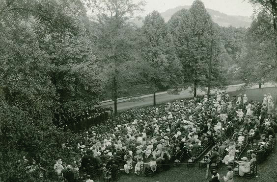 students and family members gathered on a hillside