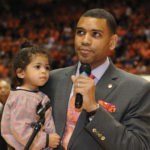 Allan Houston with his daughter on the court of Thompson Boling Arena