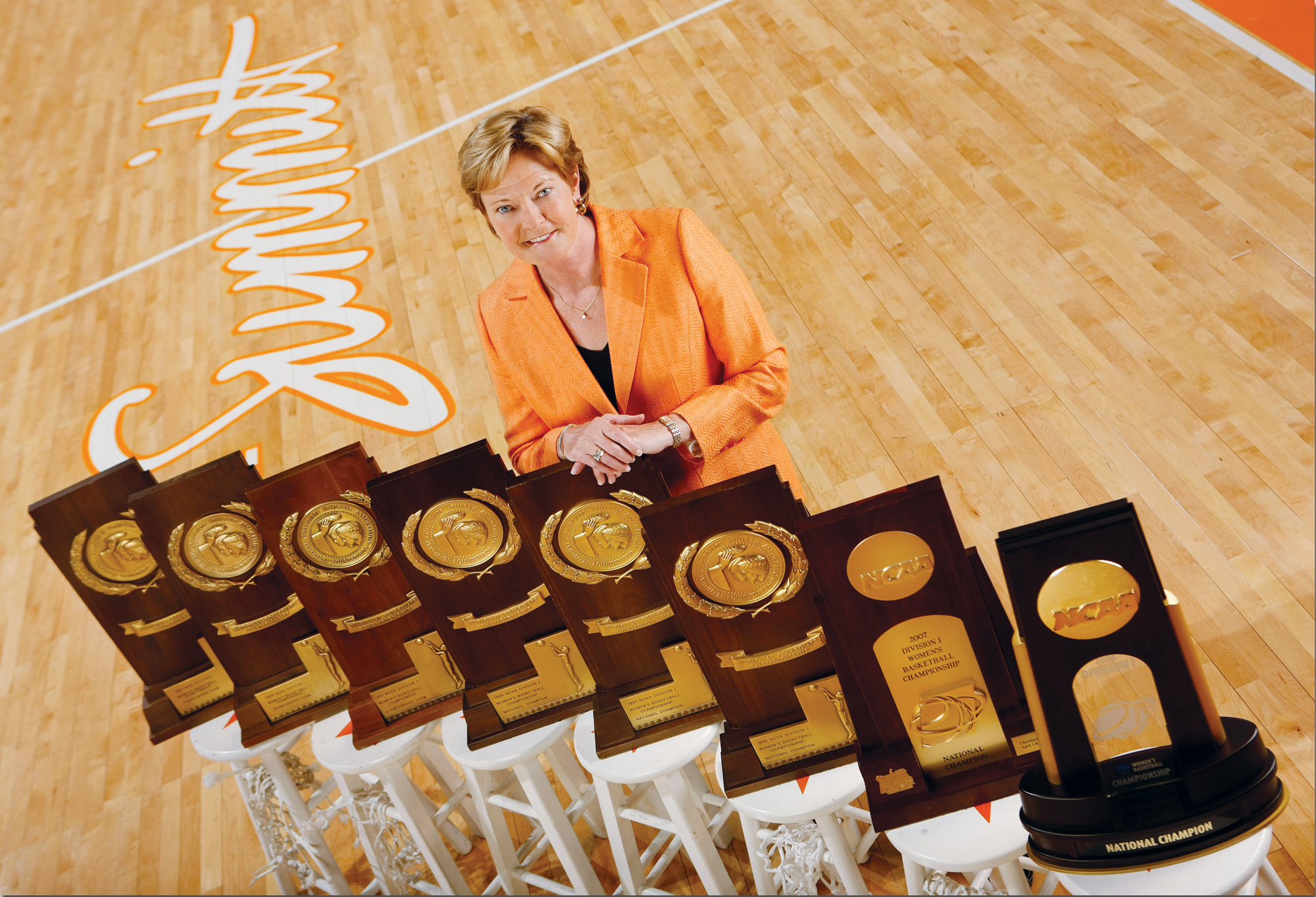 Pat Summitt pictured with her 8 NCAA championship trophies