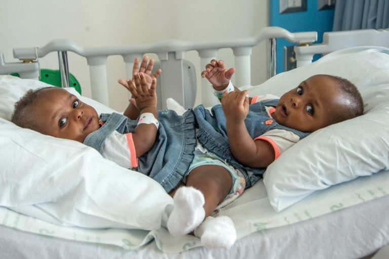 Miracle and Testimony Ayeni, conjoined twins from Nigeria, were separated from one another after an 18 hour operation that involved more than 20 surgeons and physicians, many of whom are UTHSC College of Medicine faculty, at Le Bonheur Children's Hospital in Memphis. (Photo courtesy UTHSC)