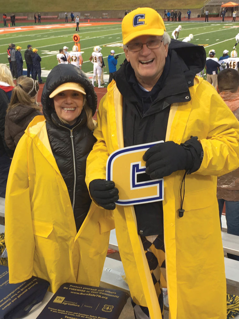 Todd Gardenhire (Chattanooga ’72) and his wife, Sylvia, brave the weather to cheer on the Mocs football team in Huntsville, Texas.