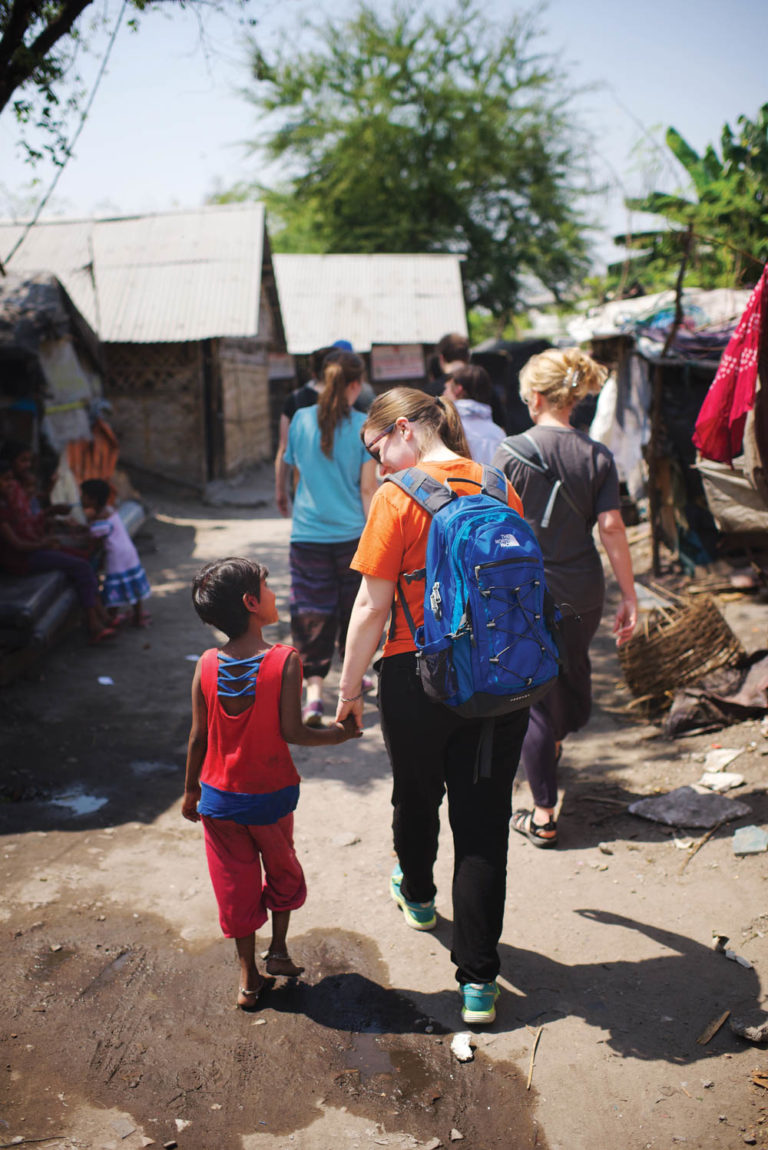 Jana Ogg with a street child in a slum in Kolkata, India, March 2015.