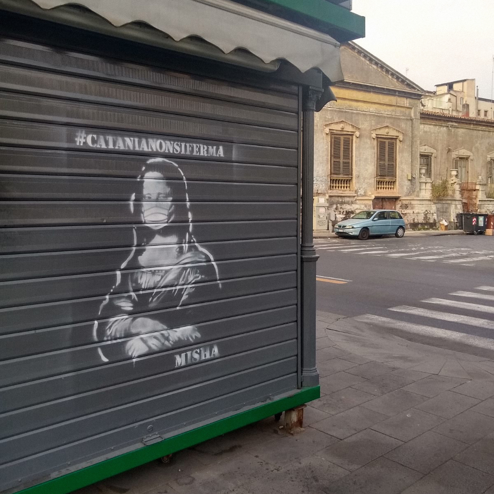 Street art in Catania Italy shows the Mona Lisa wearing a face mask