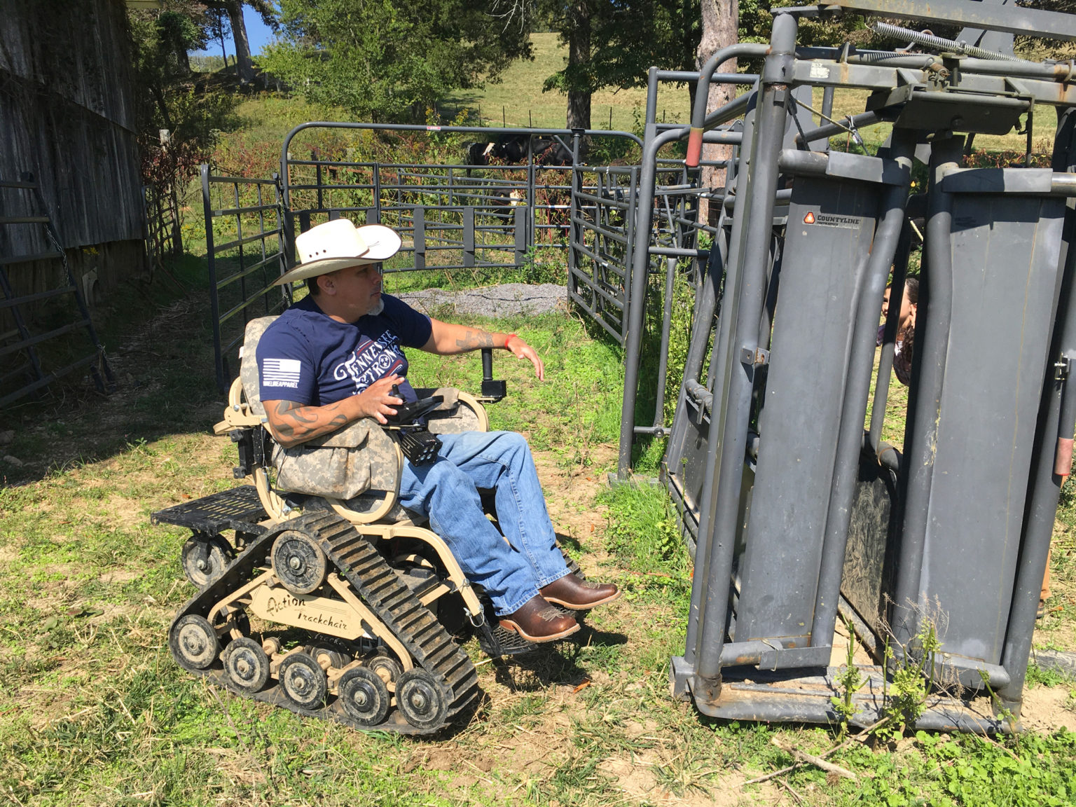 A farmer navigates his ranch on a heavy duty all-terrain wheelchair