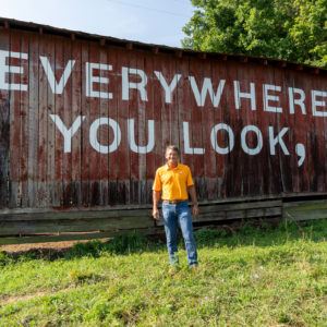 Randy Boyd stands in front of the Everywhere You Look mural in 